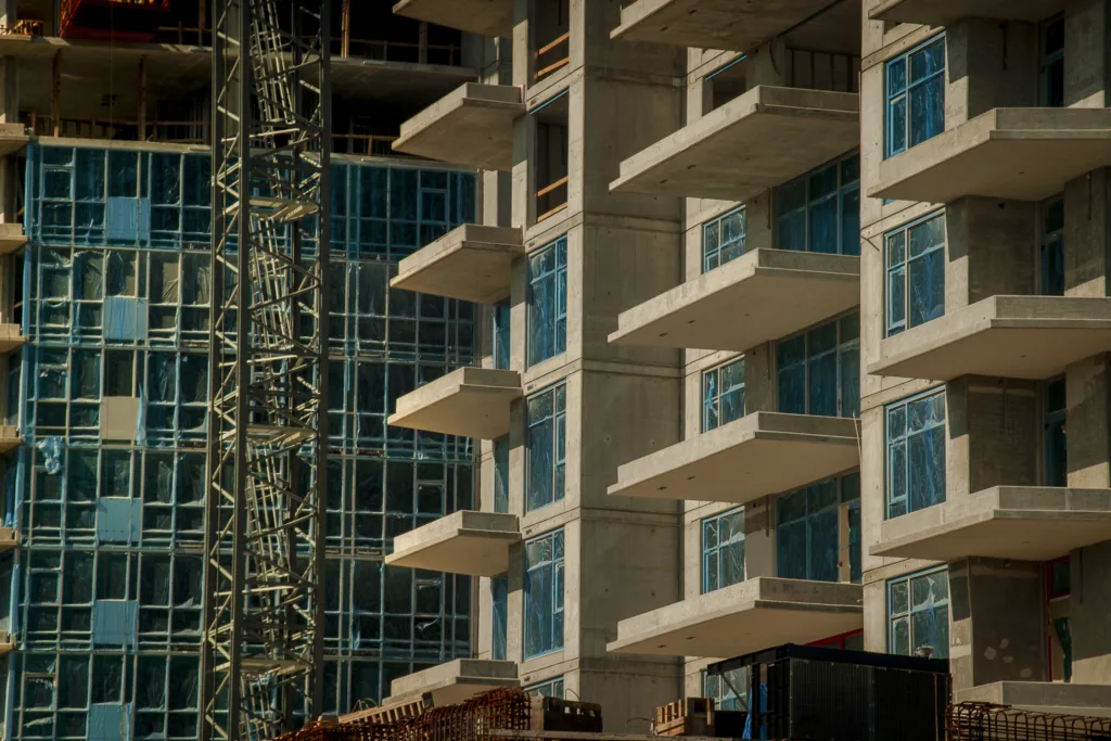 Condominium Construction With Balconies And Glass Windows