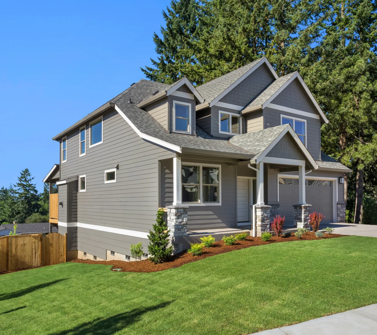 Beautiful,new,home,exterior,with,two,car,garage,and,covered