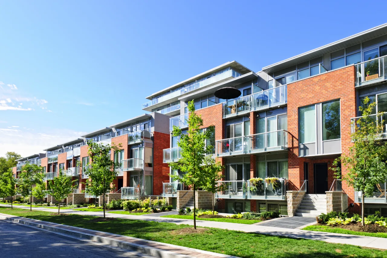 Modern,town,houses,of,brick,and,glass,on,urban,street